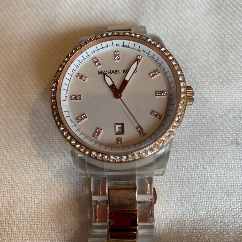 Watch Michael Kors. Large face dial. Clear band.